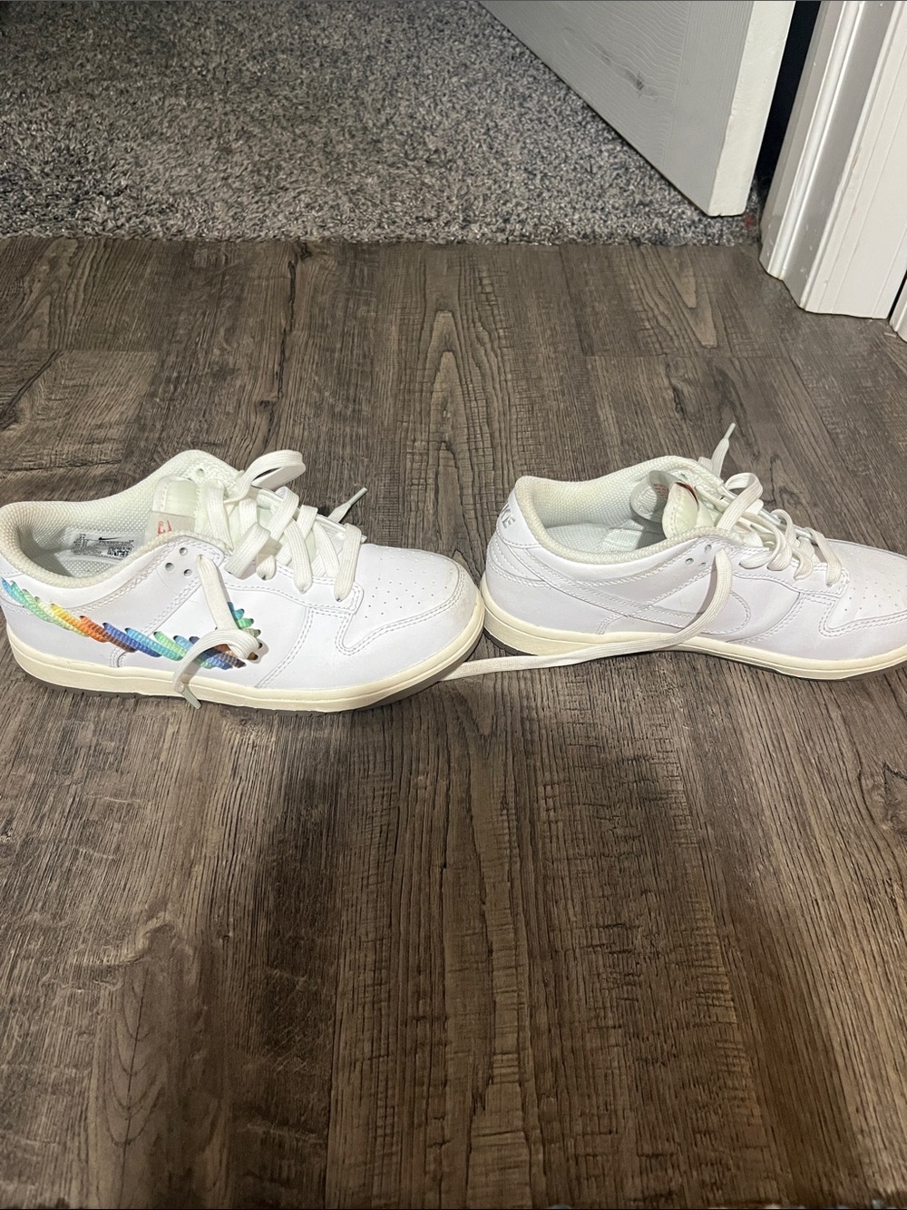 Nike Kids White Sneakers with Rainbow Swoosh Accent